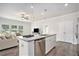 Bright, open-concept kitchen with stainless steel appliances and ample counter space at 3901 Shelleydale Dr, Powder Springs, GA 30127
