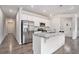 Bright kitchen with granite countertops, stainless steel appliances, and white cabinets at 3901 Shelleydale Dr, Powder Springs, GA 30127