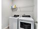 Laundry room featuring a washer, dryer, and storage shelf at 3901 Shelleydale Dr, Powder Springs, GA 30127