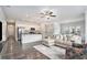 Open-concept living room and kitchen with modern finishes and hardwood style flooring at 3901 Shelleydale Dr, Powder Springs, GA 30127