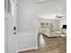 View from front door into bright living room with hardwood style flooring and modern finishes at 3901 Shelleydale Dr, Powder Springs, GA 30127