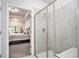 Walk-in shower featuring modern fixtures and a glass enclosure, attached to main bedroom at 3901 Shelleydale Dr, Powder Springs, GA 30127