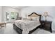 Spacious main bedroom featuring a luxurious bed and an ensuite bathroom at 3901 Shelleydale Dr, Powder Springs, GA 30127