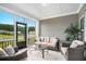 Relaxing screened porch with comfortable seating and view of the landscaped yard at 3901 Shelleydale Dr, Powder Springs, GA 30127
