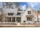 Beautiful two-story modern farmhouse with white picket fence and metal roof at 9229 Selborne Ln, Chattahoochee Hills, GA 30268