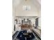 Open-concept living space with a view of the kitchen, hardwood floors, and modern decor throughout at 9229 Selborne Ln, Chattahoochee Hills, GA 30268