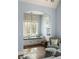 Bright sitting area features a cozy window seat, ample natural light, and stylish decor at 9229 Selborne Ln, Chattahoochee Hills, GA 30268