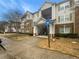 Front exterior of an apartment complex featuring brick and siding, a covered entrance, and accessible parking at 18201 Waldrop Cv, Decatur, GA 30034