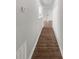 Bright hallway with light walls and wood-look flooring creates an inviting passage at 18201 Waldrop Cv, Decatur, GA 30034