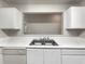 A kitchen counter with white cabinets and a stainless steel sink at 18201 Waldrop Cv, Decatur, GA 30034