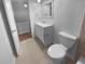 Cozy bathroom featuring a single sink vanity with white cabinets and a toilet with tiled flooring at 3085 Colonial Way # G, Atlanta, GA 30341