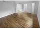 Bedroom featuring gleaming hardwood floors, walk in closet, and white trim at 3085 Colonial Way # G, Atlanta, GA 30341