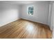 This simple bedroom features hardwood floors and a window offering natural light at 3085 Colonial Way # G, Atlanta, GA 30341