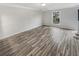 Empty living room with hardwood floors and neutral paint, ready for personalization at 3085 Colonial Way # G, Atlanta, GA 30341