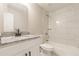 Updated bathroom featuring a vanity with granite counters and subway tile surrounding the tub at 313 Linda Dr, Tucker, GA 30084