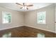 Bedroom with hardwood floors and ceiling fan at 313 Linda Dr, Tucker, GA 30084