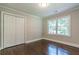 Bedroom featuring hardwood floors and closet at 313 Linda Dr, Tucker, GA 30084