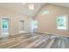 Spacious bedroom featuring high ceilings and windows overlooking a yard at 313 Linda Dr, Tucker, GA 30084