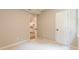 Neutral bedroom featuring carpeted floors and a door that opens to a view of the kitchen at 313 Linda Dr, Tucker, GA 30084