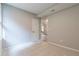 Light-filled bedroom with carpet, featuring a door with a partial view of a room with hard floors at 313 Linda Dr, Tucker, GA 30084