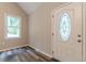 A modern entryway with decorative glass door and laminate floors at 313 Linda Dr, Tucker, GA 30084