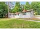 Exterior of charming renovated home with lush green lawn at 313 Linda Dr, Tucker, GA 30084