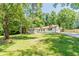 Charming renovated home with lush green lawn and mature trees offering great curb appeal at 313 Linda Dr, Tucker, GA 30084