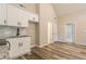 Open kitchen view with stainless steel appliances and luxury vinyl flooring at 313 Linda Dr, Tucker, GA 30084