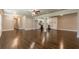 Open-concept living and kitchen area with gleaming hardwood floors at 313 Linda Dr, Tucker, GA 30084