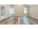 Open living area with two windows and modern floors providing natural light at 313 Linda Dr, Tucker, GA 30084