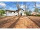 Backyard view of this home with mature trees at 3875 Wisteria Lane Southwest Sw Ln, Atlanta, GA 30331