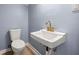 Powder room featuring modern fixtures and a sleek design at 3875 Wisteria Lane Southwest Sw Ln, Atlanta, GA 30331