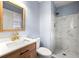 Bathroom featuring modern fixtures, wood cabinet, a large mirror, and a shower at 3875 Wisteria Lane Southwest Sw Ln, Atlanta, GA 30331