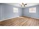 Cozy bedroom with wood floors and natural light from two windows at 3875 Wisteria Lane Southwest Sw Ln, Atlanta, GA 30331