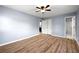 Bedroom featuring wood floors and access to an en-suite bathroom at 3875 Wisteria Lane Southwest Sw Ln, Atlanta, GA 30331