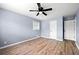 Cozy bedroom with wood-look flooring, fresh paint, and closet space at 3875 Wisteria Lane Southwest Sw Ln, Atlanta, GA 30331