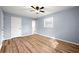 Bedroom featuring wood floors, a ceiling fan, and a window at 3875 Wisteria Lane Southwest Sw Ln, Atlanta, GA 30331