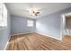 Cozy bedroom with wood floors and natural light from windows at 3875 Wisteria Lane Southwest Sw Ln, Atlanta, GA 30331