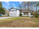 Charming two-story home features a painted brick exterior and attached two car garage at 3875 Wisteria Lane Southwest Sw Ln, Atlanta, GA 30331