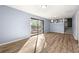 Spacious living room with wood floors and sliding glass doors leading to the outside at 3875 Wisteria Lane Southwest Sw Ln, Atlanta, GA 30331