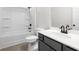 Full bathroom with a bathtub, a toilet, and a vanity with gray cabinets at 735 Shetland Trl, Cartersville, GA 30121