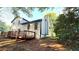 Backyard view showcasing a large wooden deck, perfect for outdoor entertainment at 101 Summer Pond Trl, Lawrenceville, GA 30046