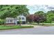 A well-maintained home nestled among lush greenery, complemented by a neatly kept lawn at 101 Summer Pond Trl, Lawrenceville, GA 30046
