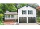 Charming two-story home boasts a welcoming front porch and a convenient two-car garage at 101 Summer Pond Trl, Lawrenceville, GA 30046
