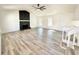 Bright living room boasts hardwood floors, a ceiling fan, a fireplace, and lots of natural light at 101 Summer Pond Trl, Lawrenceville, GA 30046