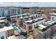 High aerial view of a new construction community, featuring modern brick townhomes with rooftop decks and a pool at 1226 Chelsea Nw Cir, Atlanta, GA 30318