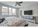 Spacious bedroom with plenty of light, mirrored dresser, ceiling fan, and neutral colors at 1226 Chelsea Nw Cir, Atlanta, GA 30318