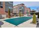View of the community pool, covered for the winter, with a seating area and modern buildings in the background at 1226 Chelsea Nw Cir, Atlanta, GA 30318