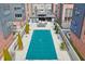 Aerial view of the covered community pool and outdoor kitchen, surrounded by modern brick buildings at 1226 Chelsea Nw Cir, Atlanta, GA 30318