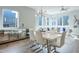 Inviting dining area with a modern table, seating for six, and a stylish sideboard with mirrored doors at 1226 Chelsea Nw Cir, Atlanta, GA 30318
